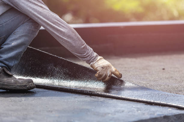 Professional Basement Waterproofing technician working in Winfield, KS